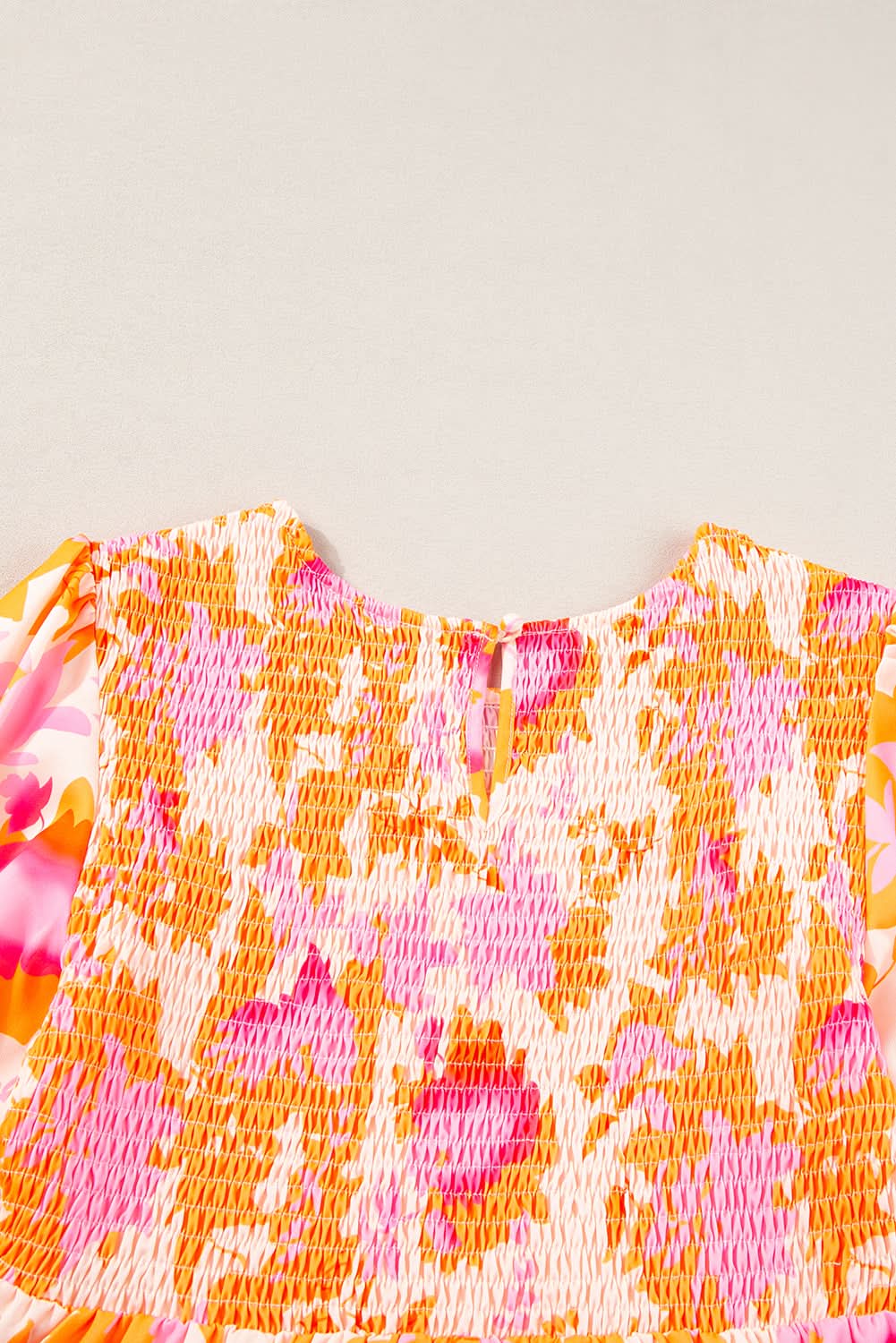 Orange smocked mini dress