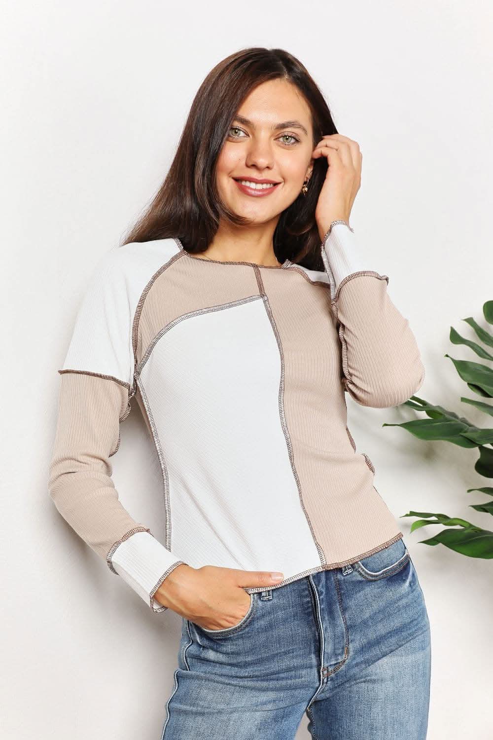 Color block top with exposed seams and comfortable fit.