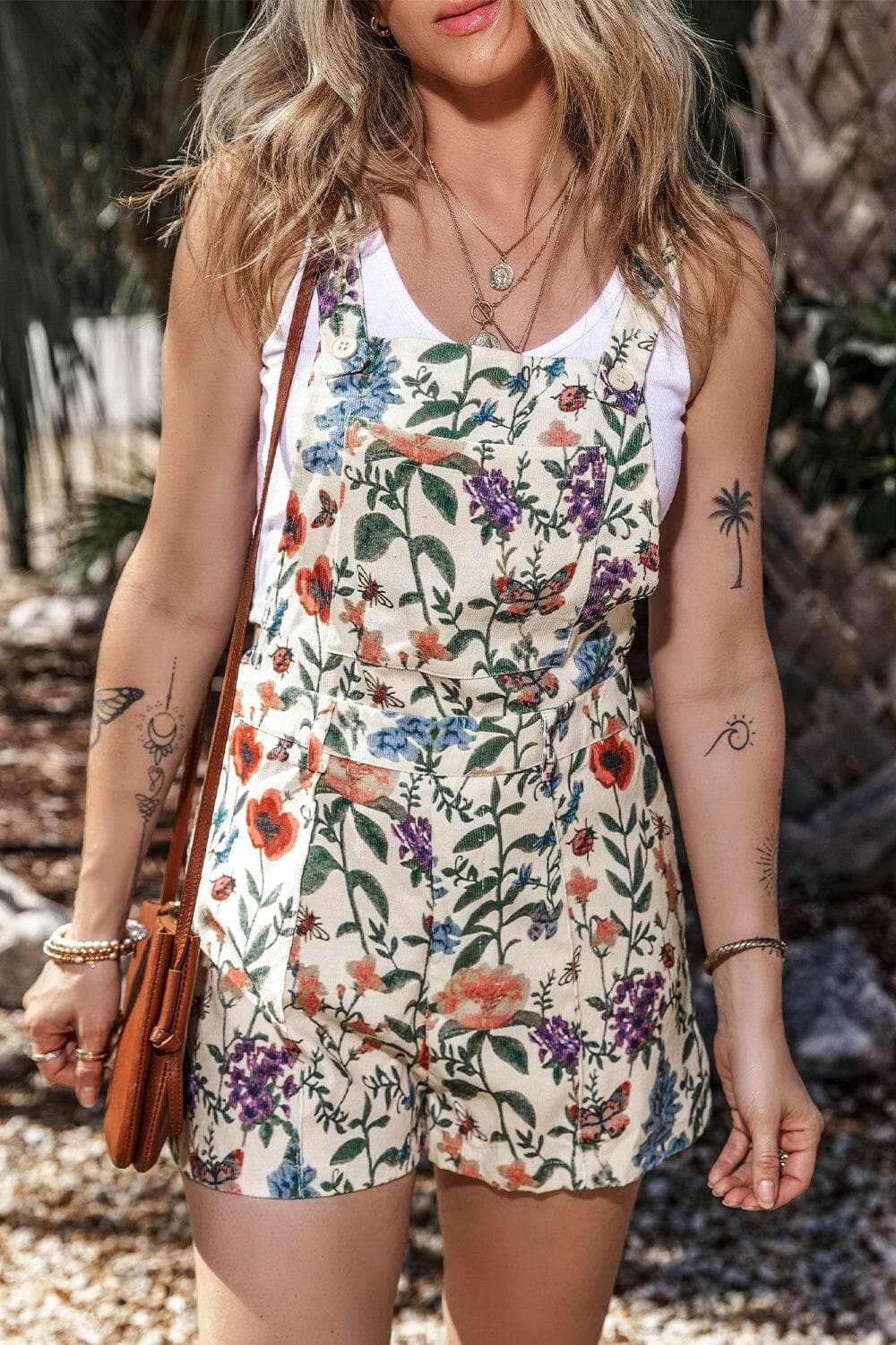 Printed square neck wide strap romper with floral design and comfortable fit.