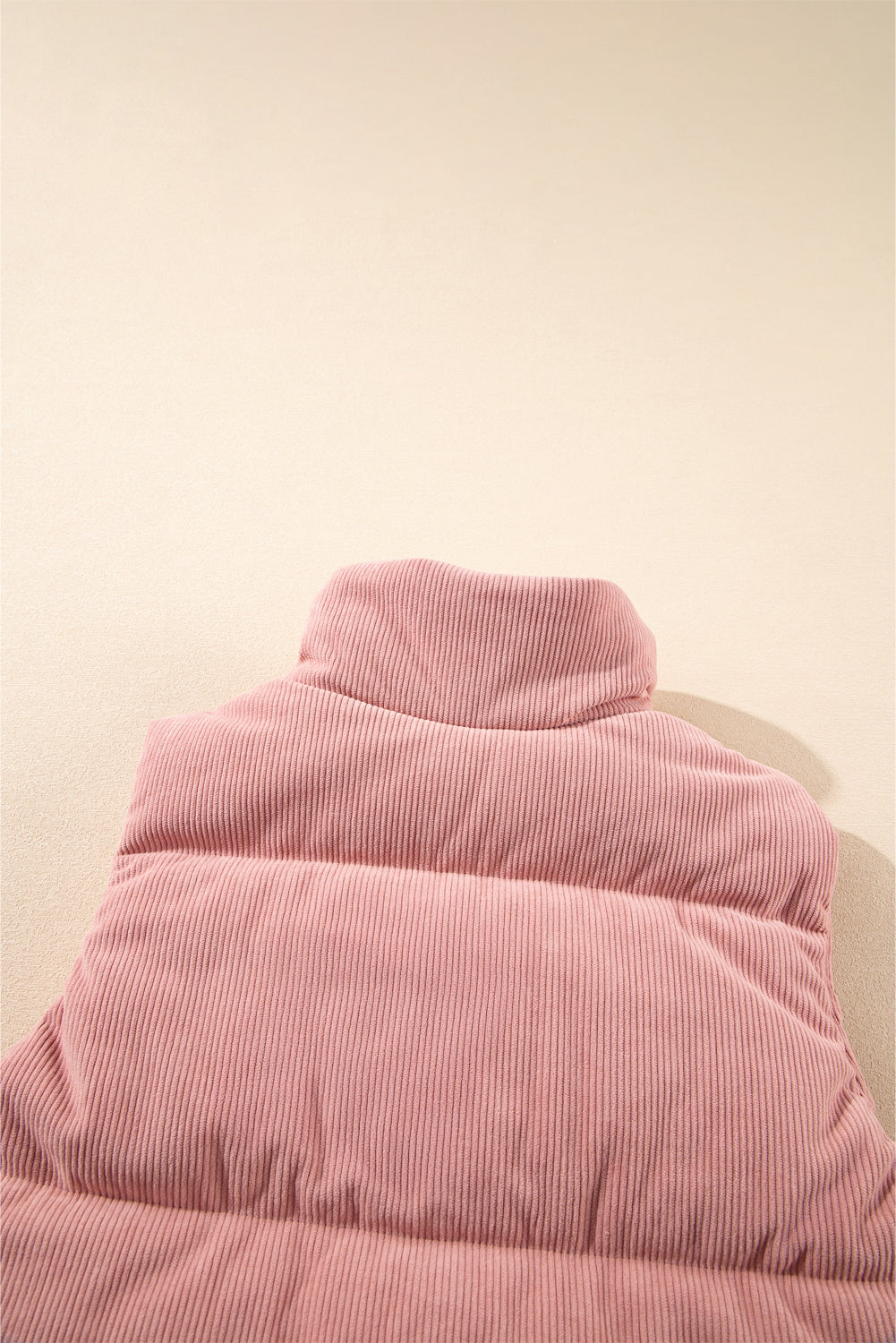 Apricot Pink Corduroy Stand Neck Zipped Puffer Vest by De...