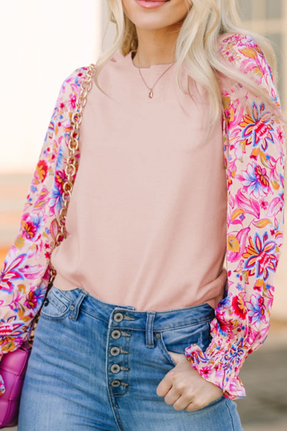 Printed round neck flounce sleeve sweater with floral design.