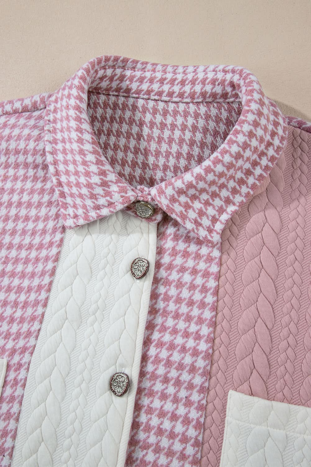 Pink houndstooth color contrast textured patchwork loose shacket with button details.