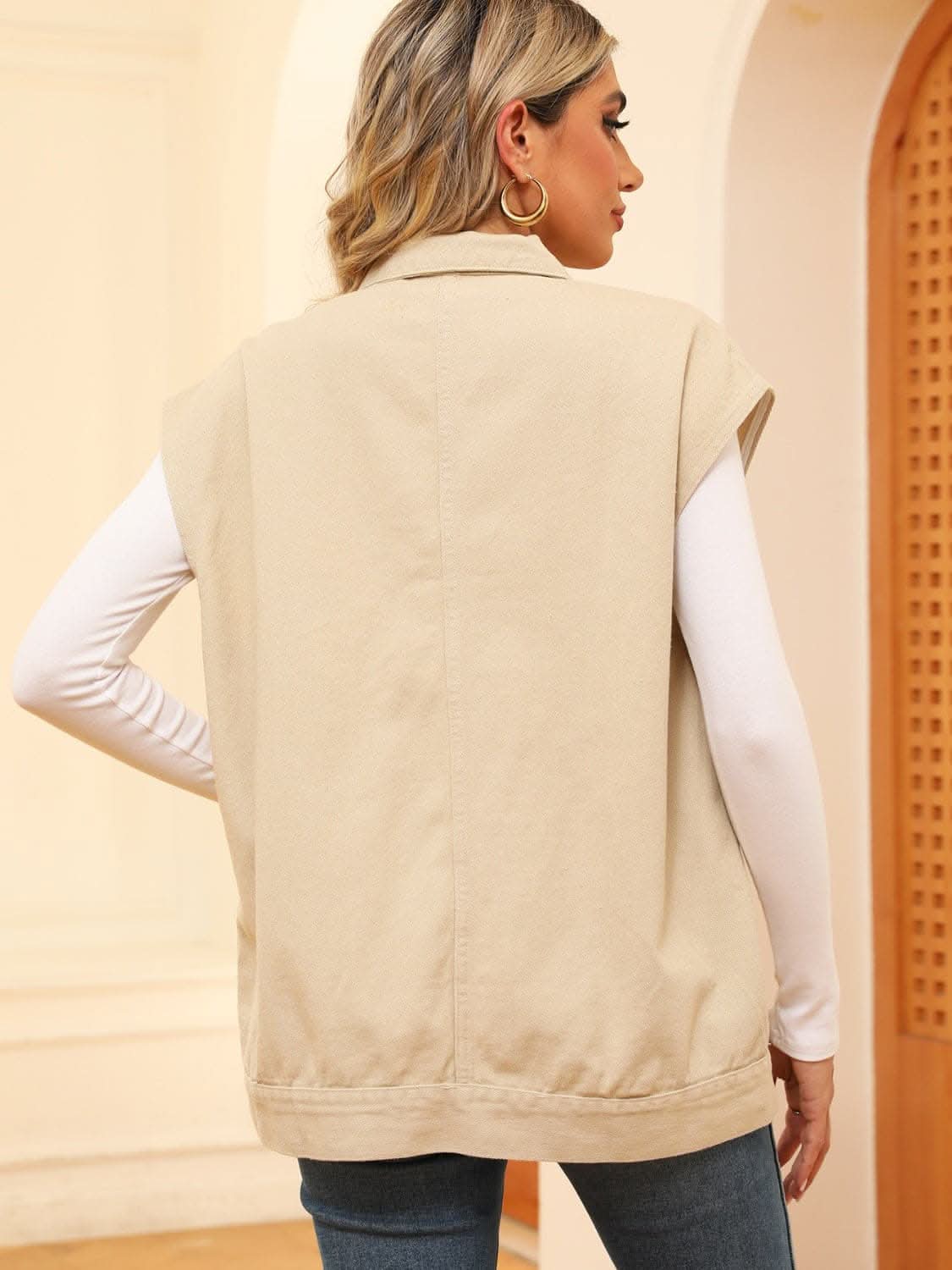 Sleeveless denim jacket with pockets