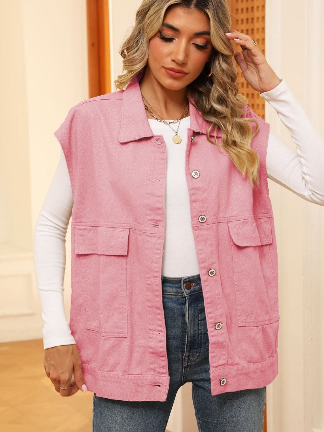 Sleeveless denim jacket with pockets