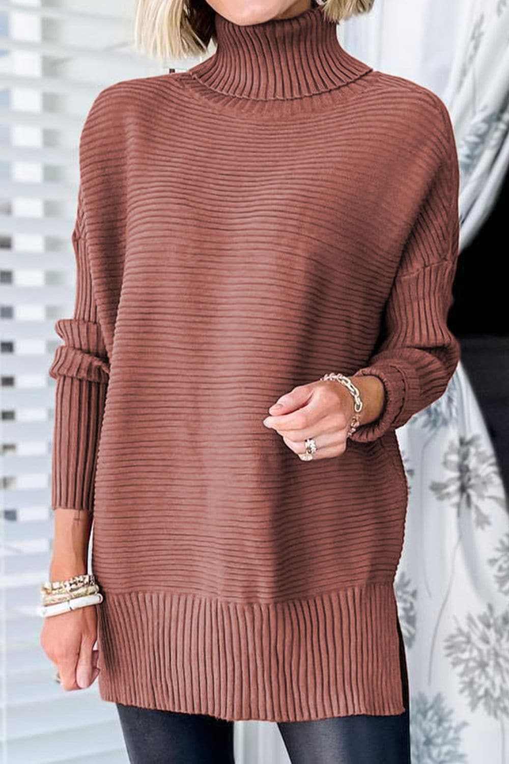 Cozy ribbed turtleneck pullover in brown, featuring a classic design with slightly stretchy fabric for comfort.