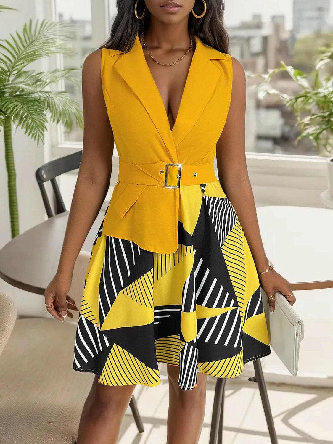 Collared sleeveless mini dress with geometric pattern in yellow and black, featuring a structured fit and belt.