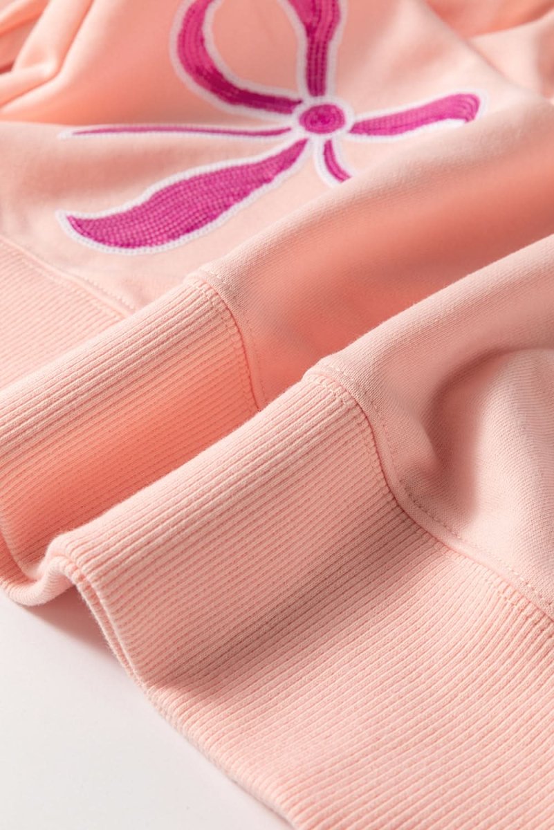 Apricot Pink Sequined Bowknot Drop Shoulder Oversized Sweatshirt - Love Salve