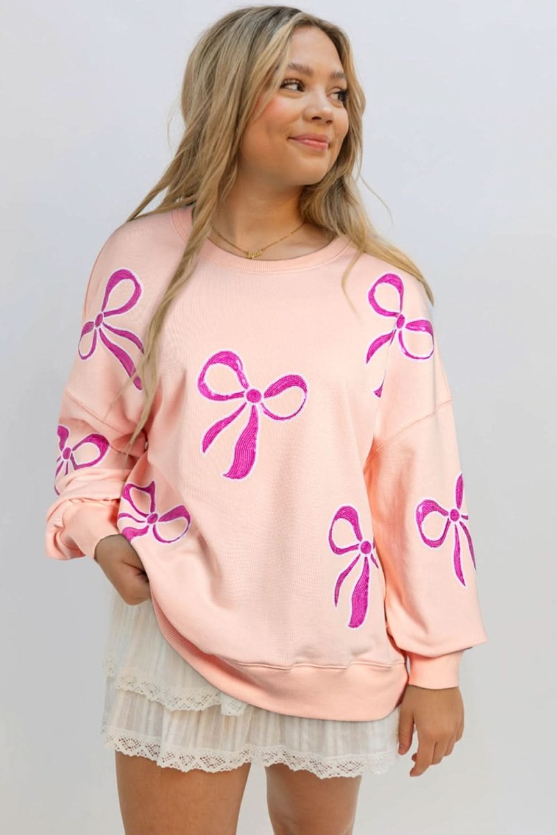 Apricot Pink Sequined Bowknot Drop Shoulder Oversized Sweatshirt - Love Salve