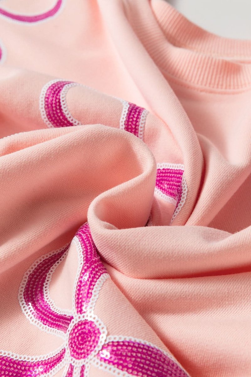 Apricot Pink Sequined Bowknot Drop Shoulder Oversized Sweatshirt - Love Salve