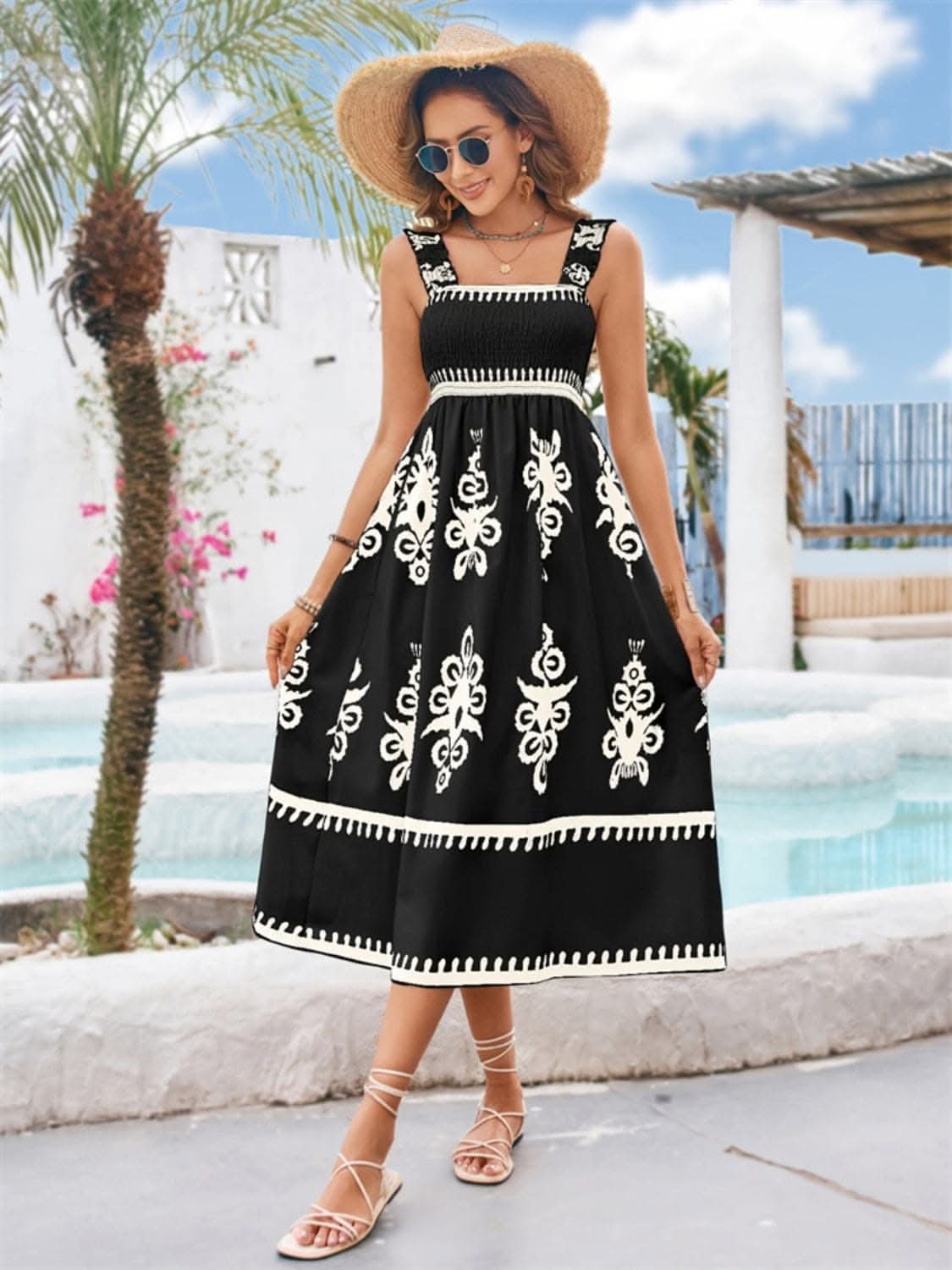 Chic square neck midi dress with embroidered pattern, ideal for summer occasions.