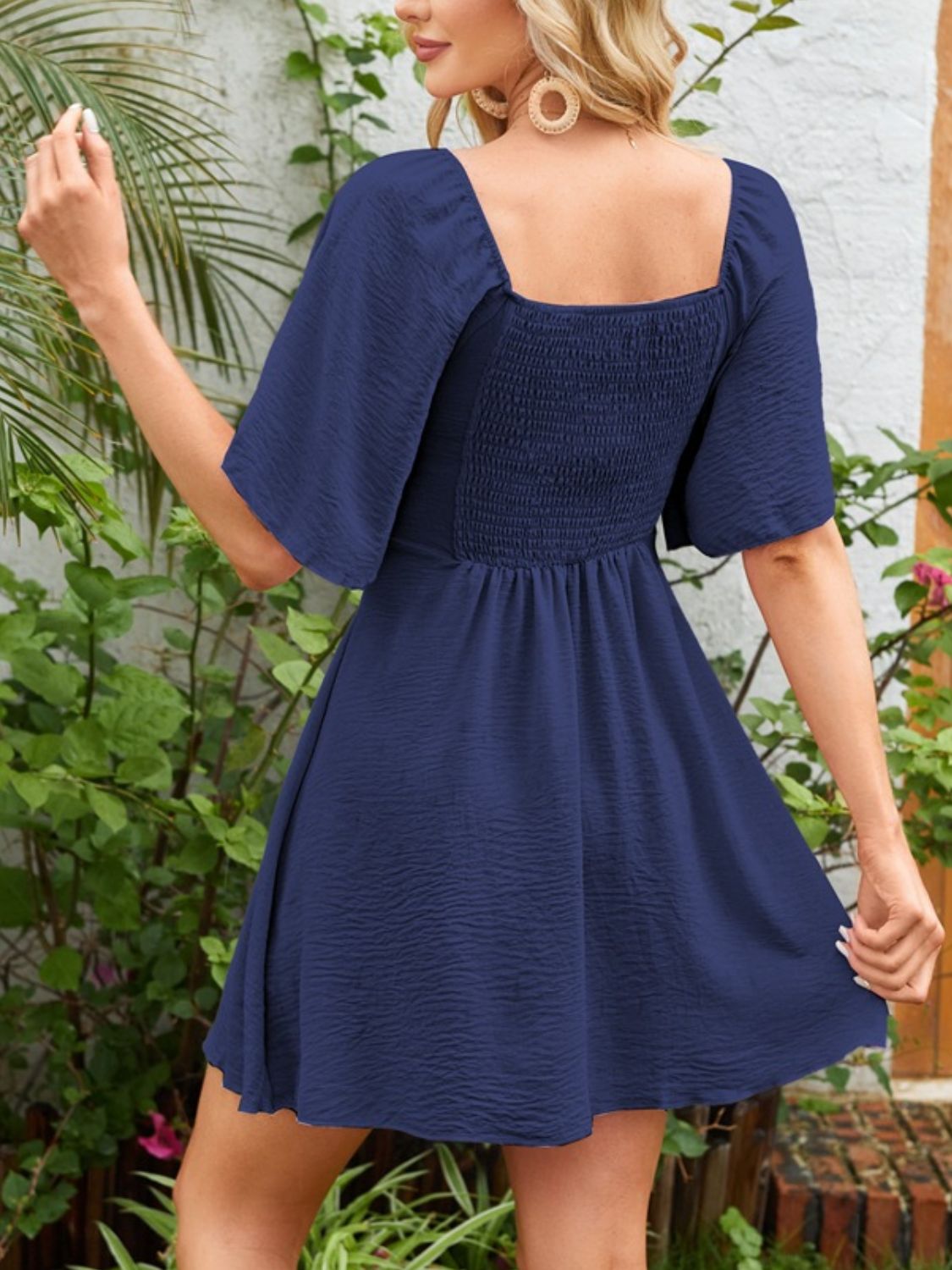 Breezy Charm Smocked Flutter Dress