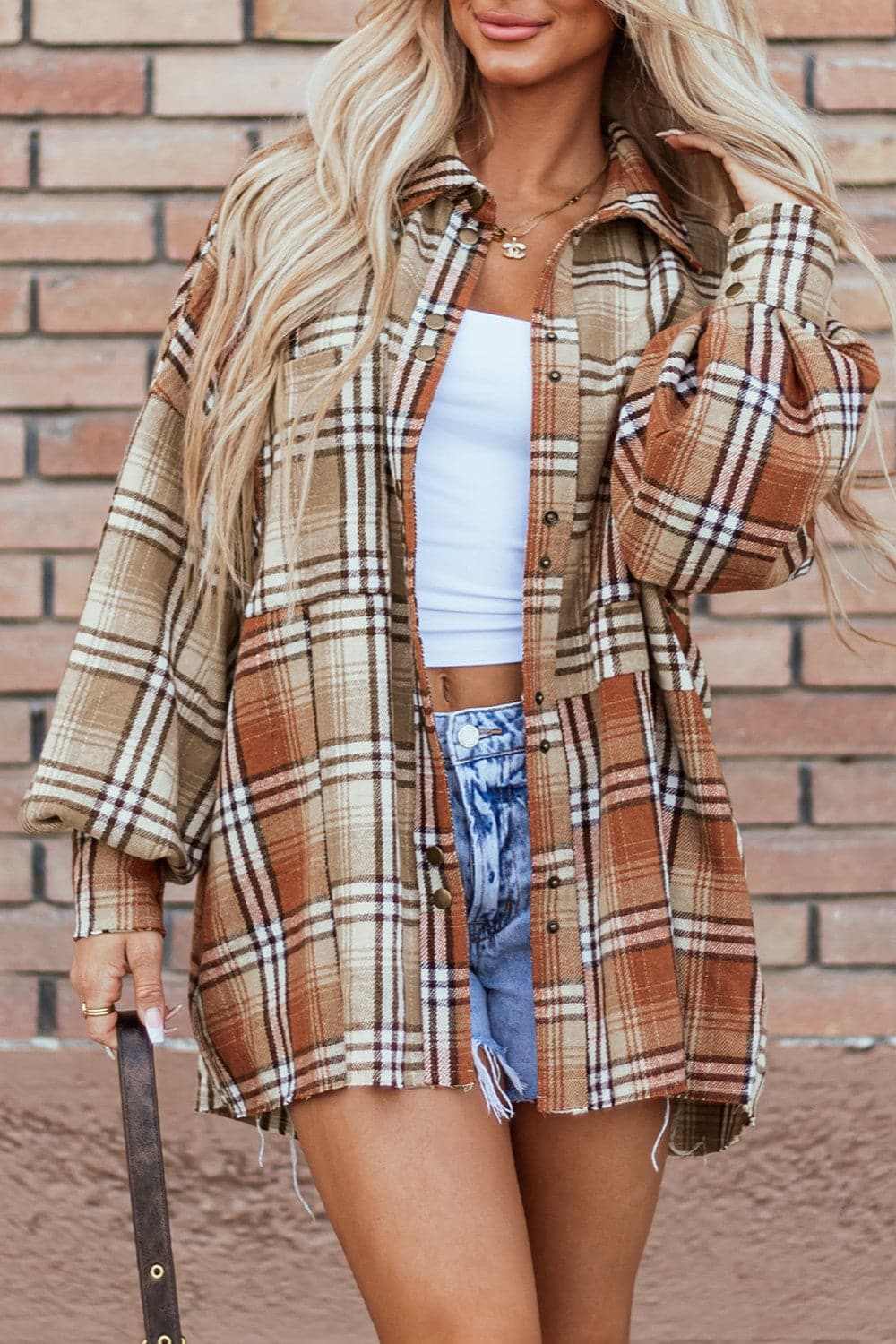Plaid shacket with pockets, 100% polyester, dropped shoulder style.