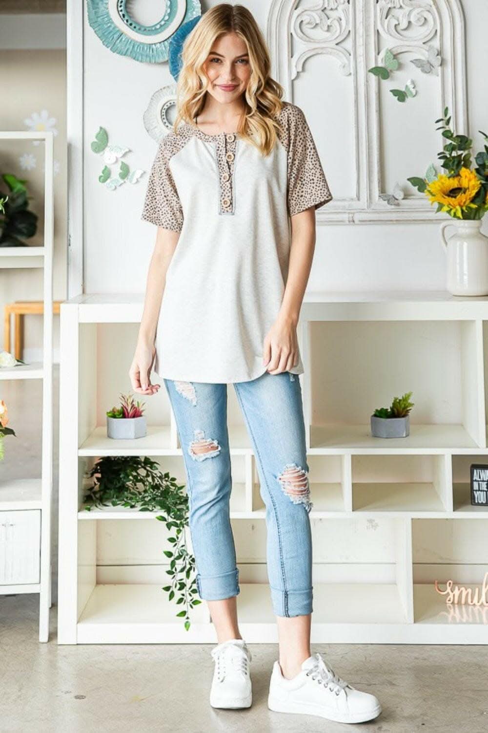Untamed Elegance: Heimish Animal Print Half-Button Top - Love Salve