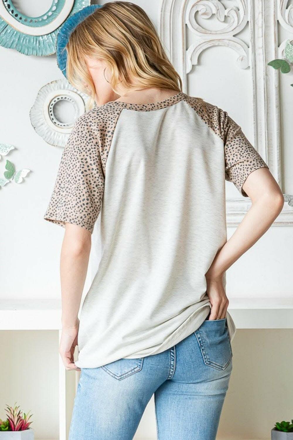 Untamed Elegance: Heimish Animal Print Half-Button Top - Love Salve