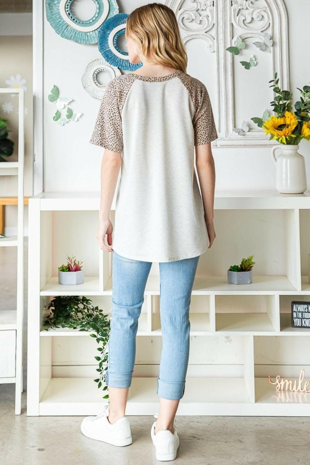Untamed Elegance: Heimish Animal Print Half-Button Top - Love Salve