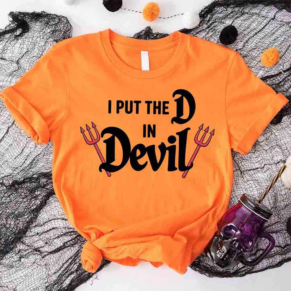 Adorb.co's "I Put the D in Devil" couples matching shirts laid flat, an easy and humorous devil costume idea for two.