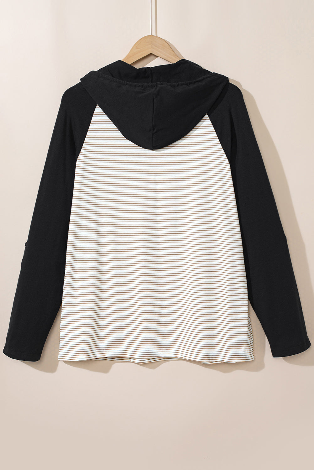 Plus size black and white striped hoodie with raglan sleeves and button pocket