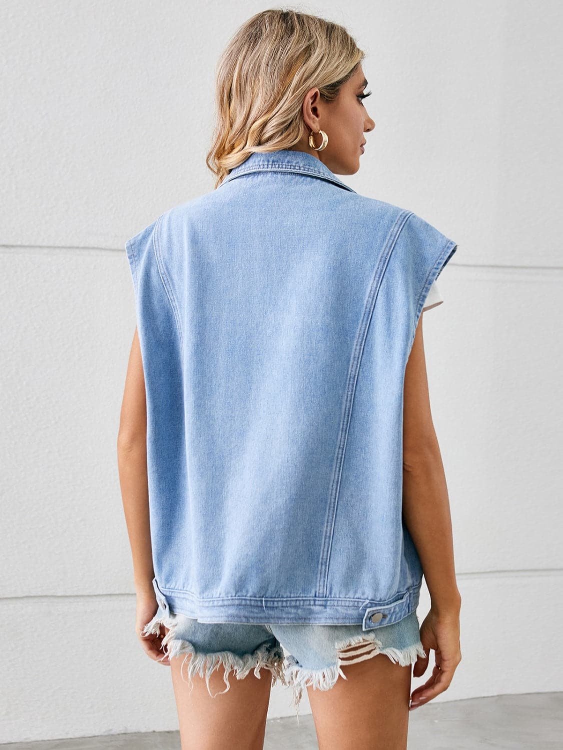 Pocketed Button Up Sleeveless Denim Jacket.