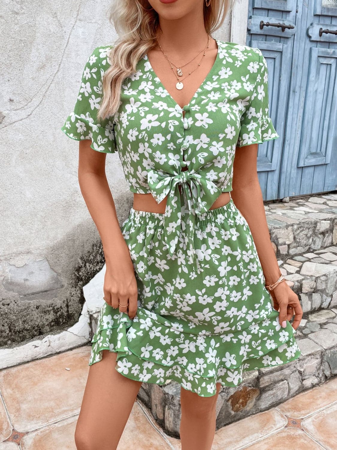 Tied Printed V-Neck Flounce Sleeve Mini Dress.