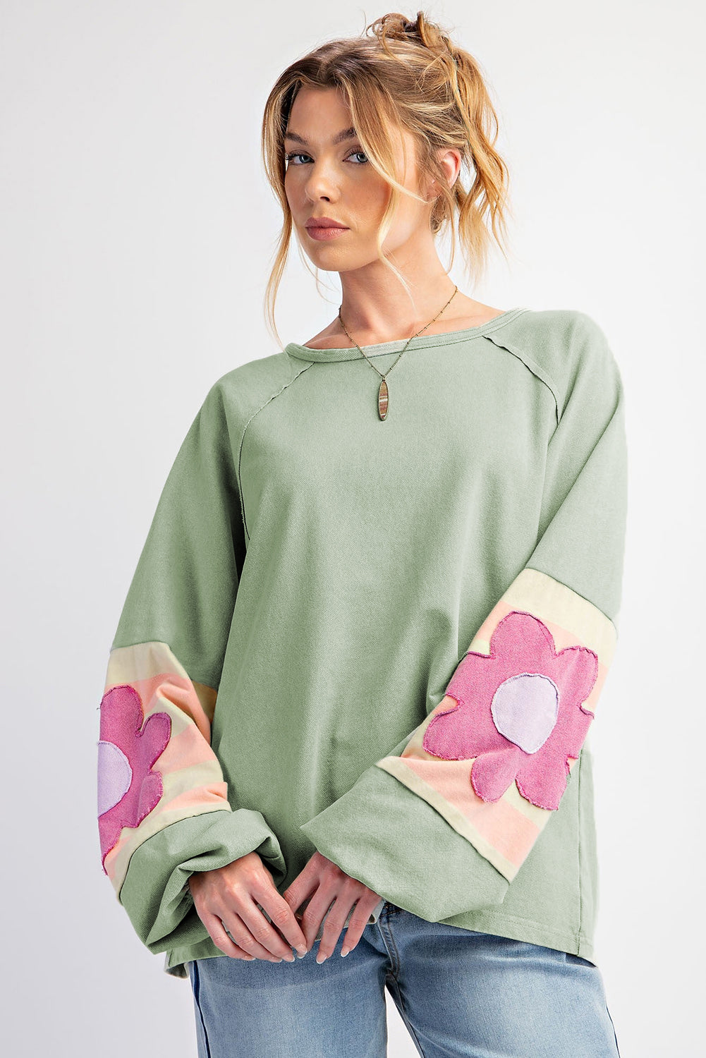 Floral patchwork oversized top with exposed seams in smoke green