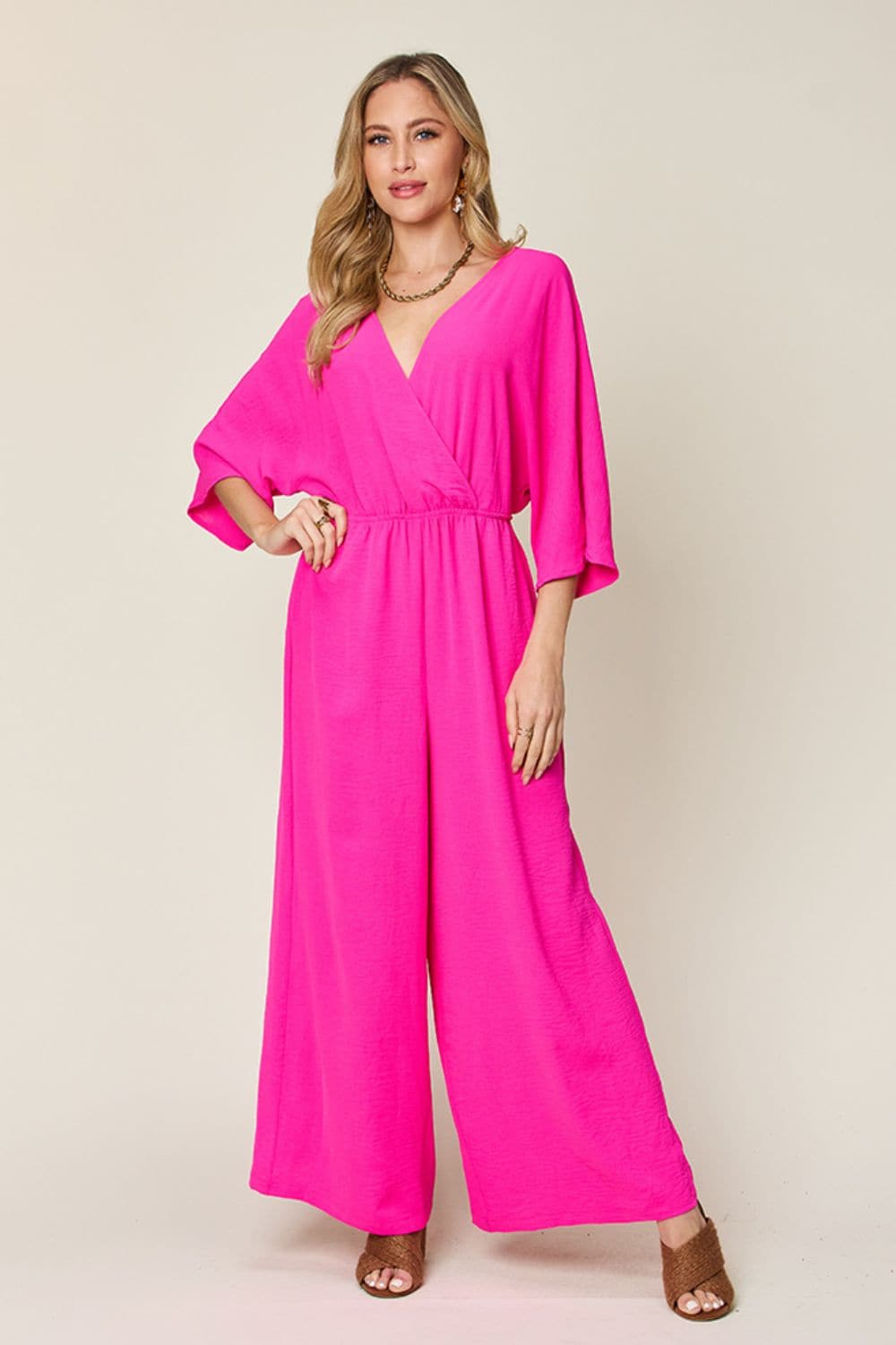 Double Take Full Size Surplice Wide Leg Jumpsuit with Pockets.