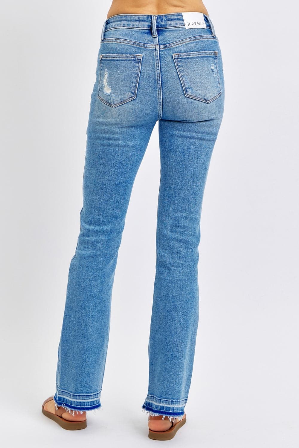 Judy Blue Full Size Mid Rise Destroyed Hem Distressed Jeans.