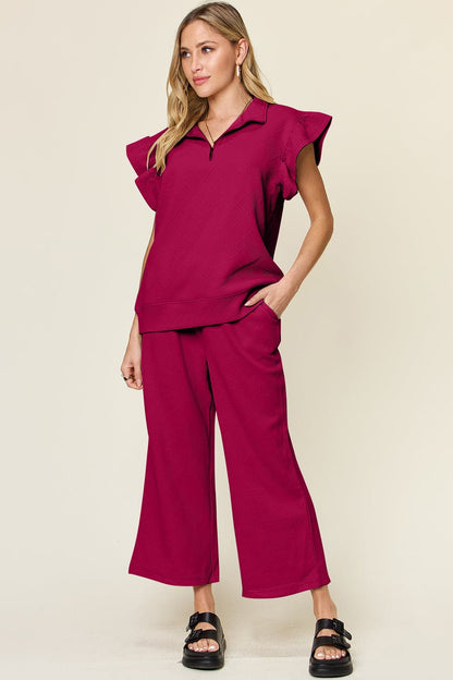 Double Take Texture Ruffle Short Sleeve Top and Drawstring Wide Leg PaFeatures: Drawstring, Pocketed
Number of pieces: Two-piece
Stretch: Slightly stretchy
Material composition: 97% polyester, 3% spandex
Care instructions: Machine washLove Salve Texture Ruffle Short Sleeve TopTwo-Piece Sets