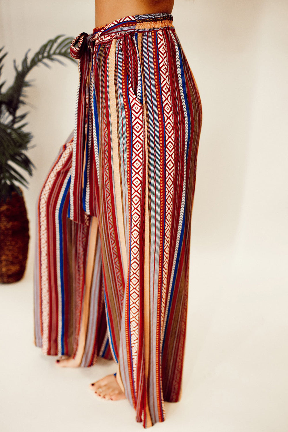 Vibrant red bohemian wide leg pants with ethnic stripes and tie waist