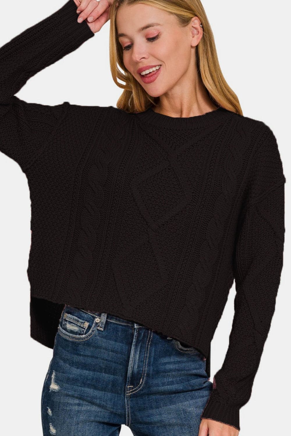 Chic cropped cable knit sweater with stylish high-low hem