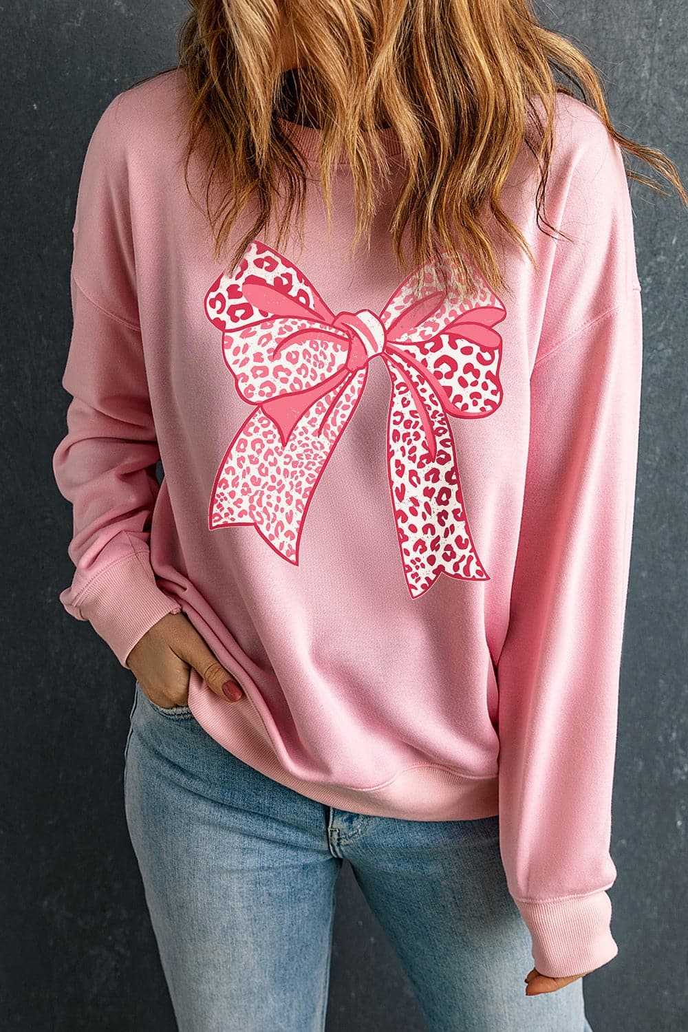 Bow Graphic Round Neck Long Sleeve Sweatshirt.