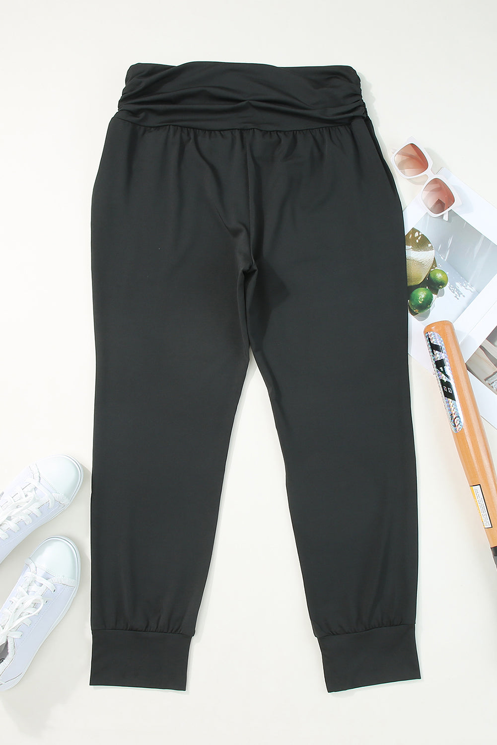 Stylish black high-waisted plus-size skinny trousers with pockets