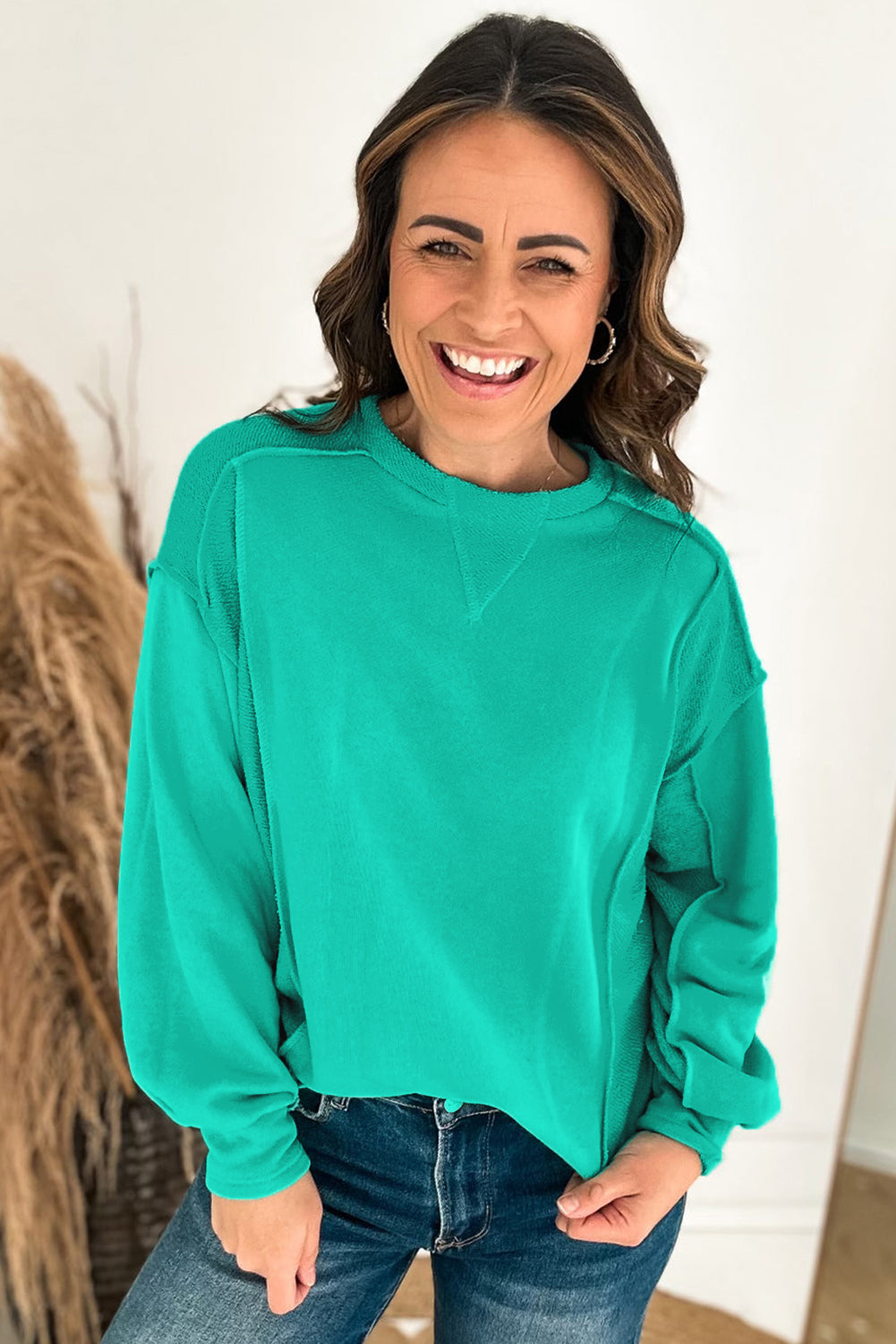 Mint green spliced pullover sweatshirt with round neckline