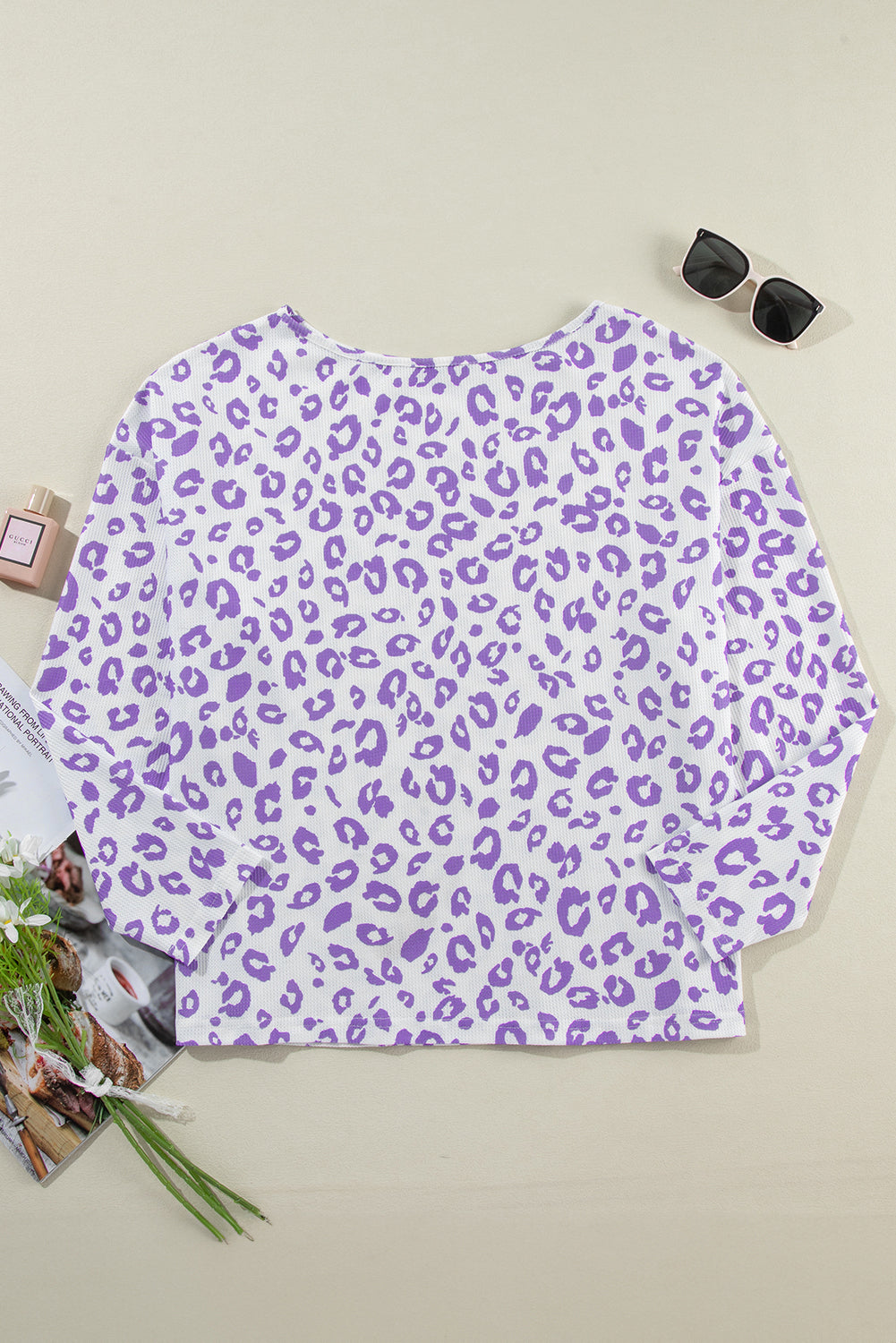 Cozy purple leopard print top with boat neck and drop shoulders