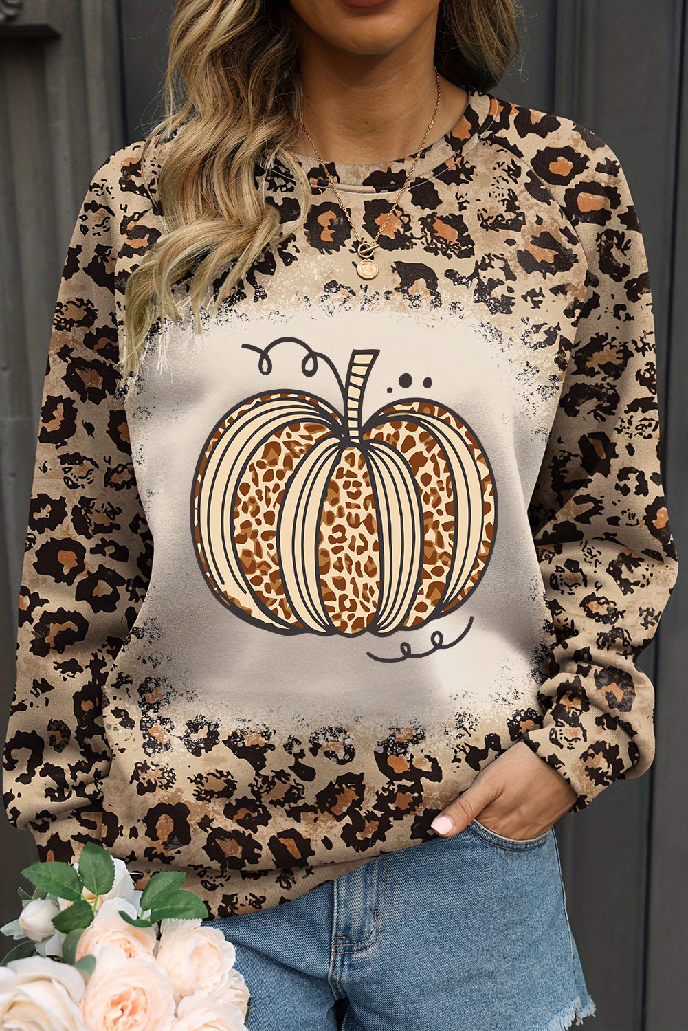 Leopard print pumpkin sweatshirt with a bleached design for Halloween celebrations