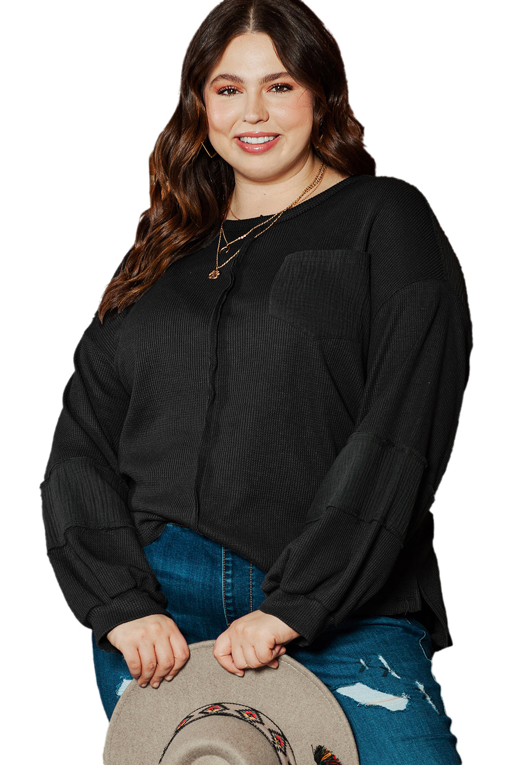 Chic black crinkle patchwork top in plus sizes with exposed seams