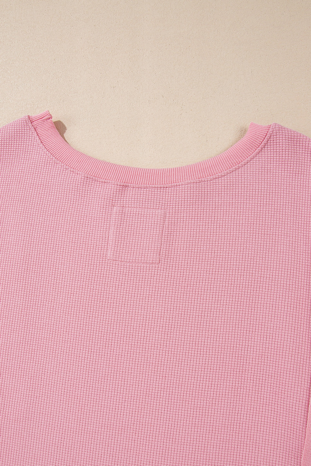 Cozy pink oversized sweatshirt with bishop sleeves and split detail