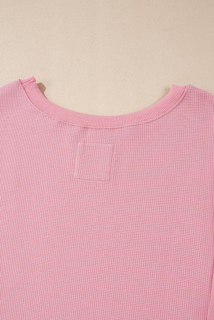 Cozy pink oversized sweatshirt with bishop sleeves and split detail