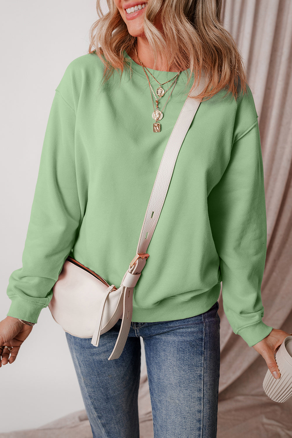 Cozy smoke green fleece-lined sweatshirt with drop shoulder design