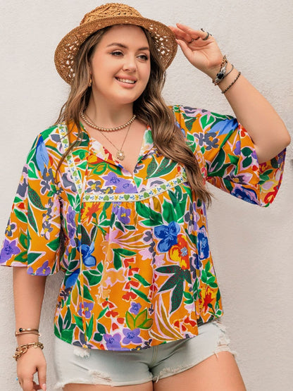 Plus Size Printed Tie Neck Half Sleeve Blouse.