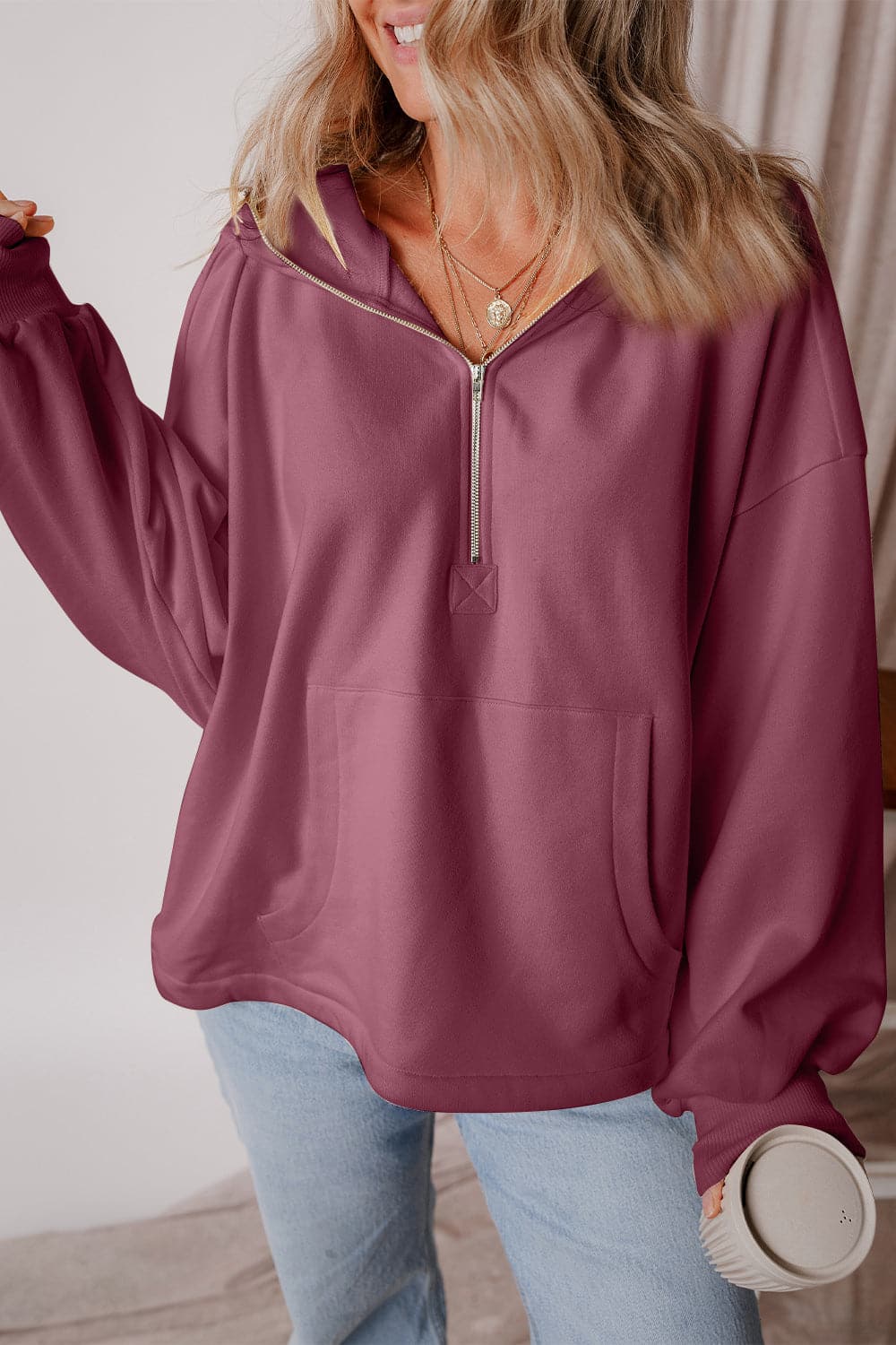 Pocketed Half Zip Dropped Shoulder Hoodie.