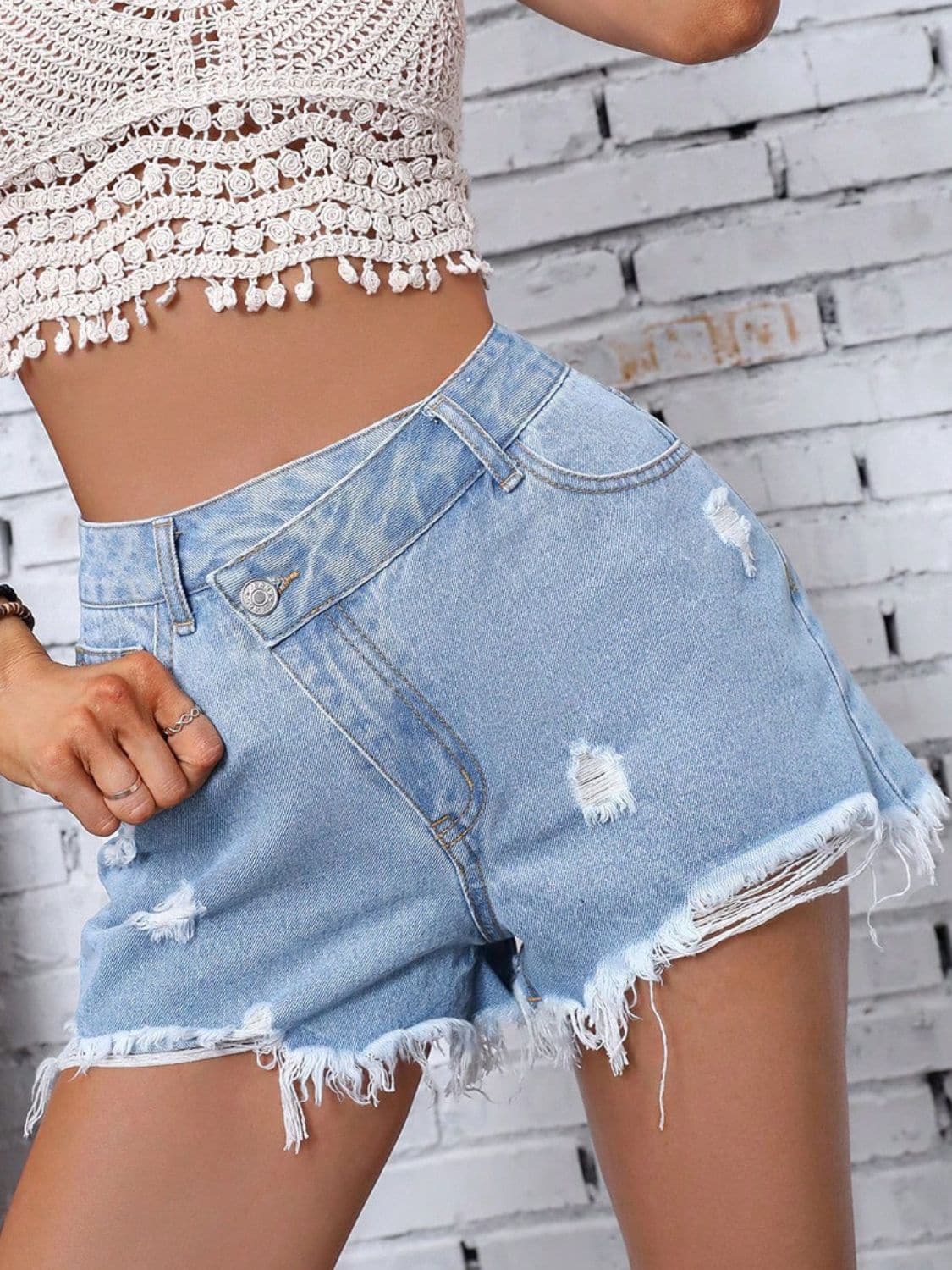 Distressed Raw Hem Denim Shorts.