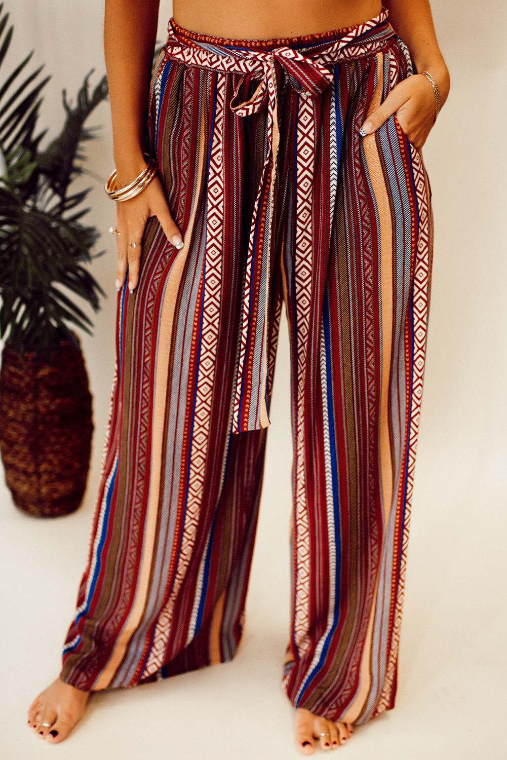 Vibrant red bohemian wide leg pants with ethnic stripes and tie waist