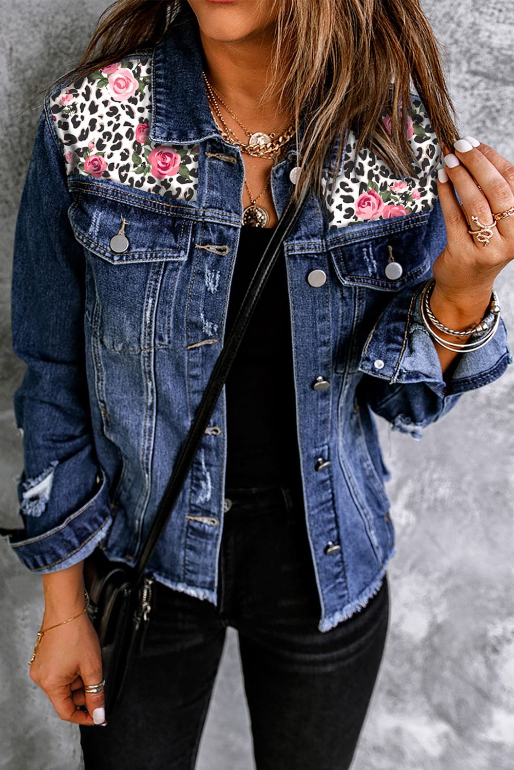 Mixed print distressed button front denim jacket with edgy flair.