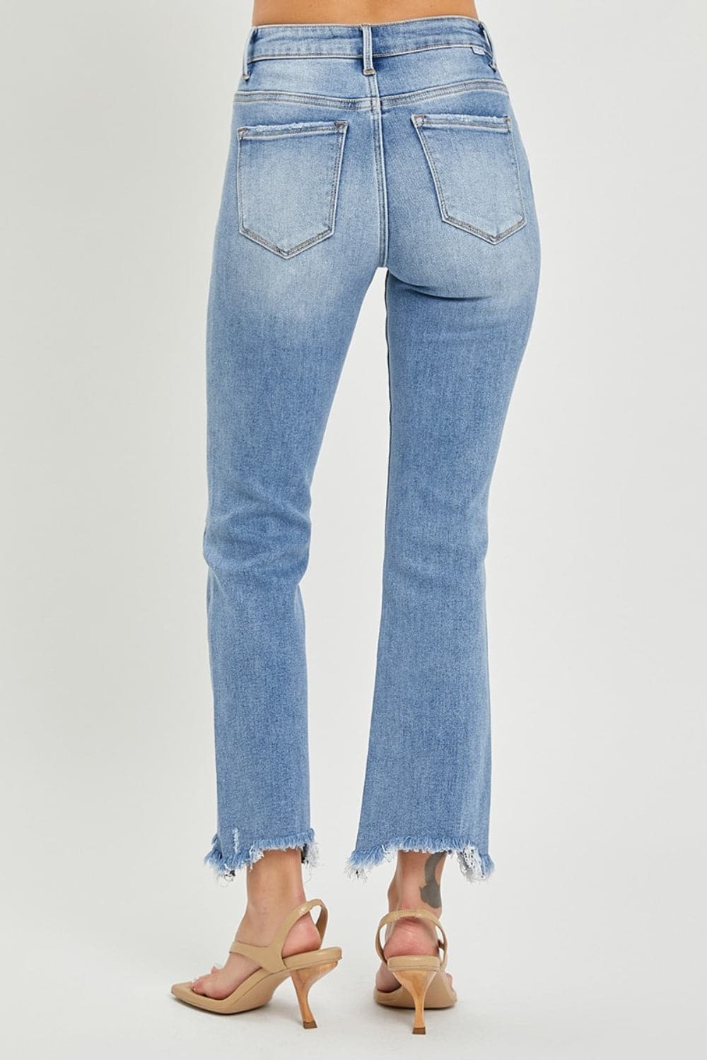 RISEN Full Size Frayed Hem Cropped Straight JeansTrendy and Stylish Design

Frayed hem cropped straight jeans are a trendy and stylish choice for a casual and chic look. The frayed hem adds a touch of edginess and Love Salve RISEN Full Size Frayed Hem Cropped Straight JeansJeans