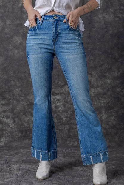 Chic light blue distressed flare jeans for a trendy look