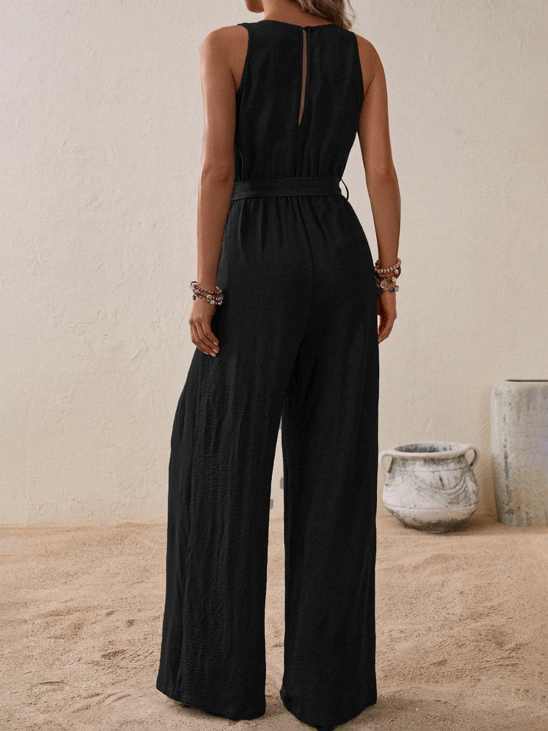 Tied Surplice Sleeveless Wide Leg Jumpsuit.