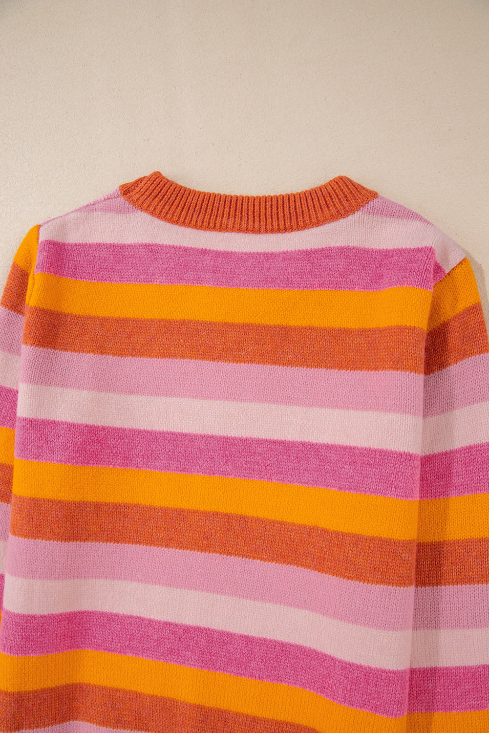 Vibrant orange color block ribbed neck sweater with long sleeves