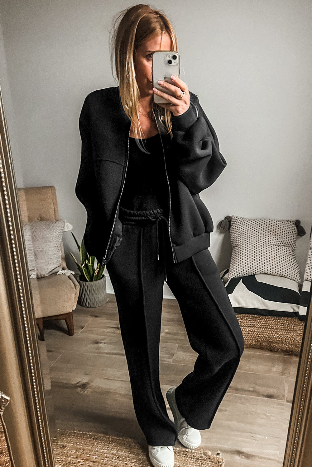 Chic black seamed zip jacket and drawstring waist pants ensemble