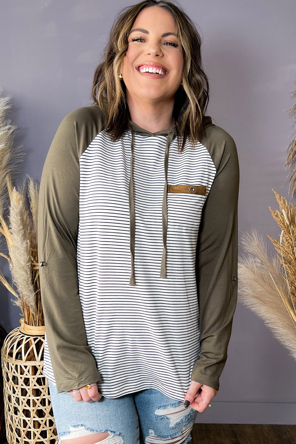 Green striped plus size hoodie with raglan sleeves and buttoned pocket