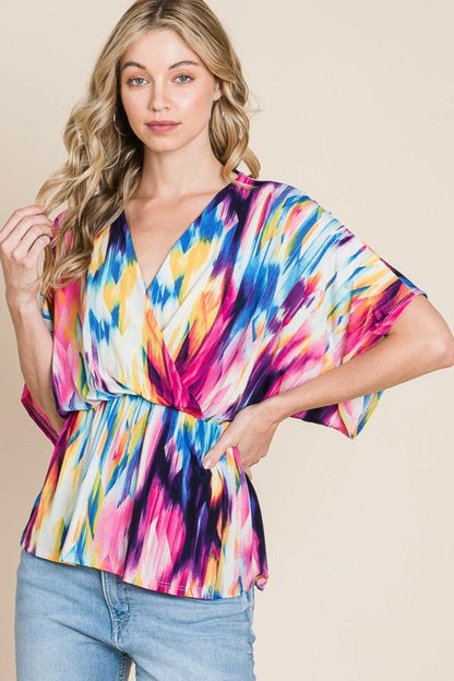 BOMBOM Printed Surplice Peplum Blouse.